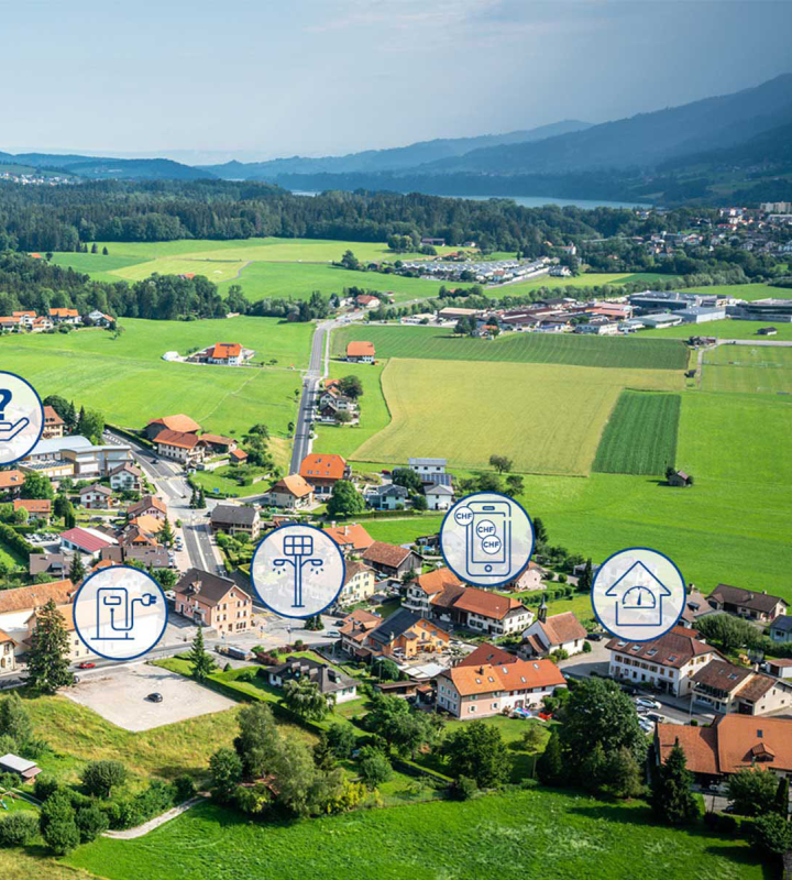 Luftaufnahme eines Dorfes in der Westschweiz